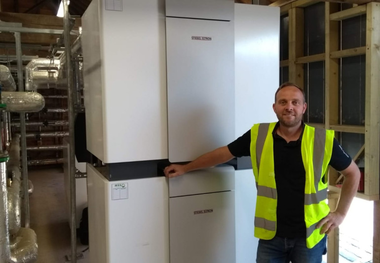 Total NRG Ltd with Bryan Jones next to a Stiebel Eltron GSHP fitted in Malpas, Cheshire