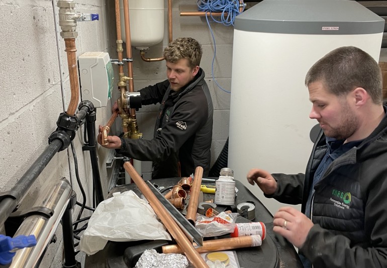 Total NRG team installing ASHP